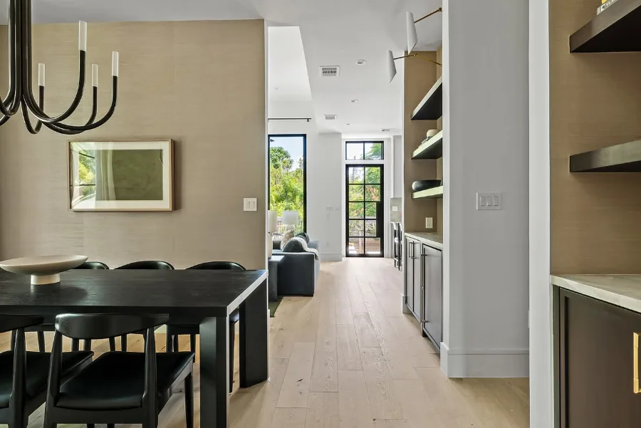 Modern Austin home interior with black dining table and light wood floors
